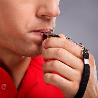 Pixwords The image with man, face, person, whistle, red, mouth, hand Mystock88photo