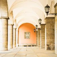 Pixwords The image with hall, hallway, building, window, lamps, orange, pillar, pillars Fottoo