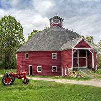 Pixwords The image with stable, tractor, green, sky, clouds Christian Delbert (Babar760)