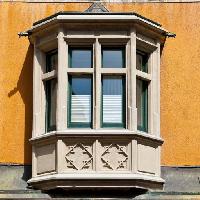 Pixwords The image with windows, balcony, window, yellow, orange, building Gkuna