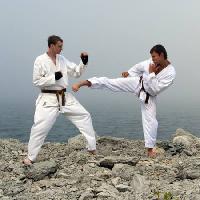 fighters, karate, men, rocks, cliff, sea, water Dmitri Maruta - Dreamstime