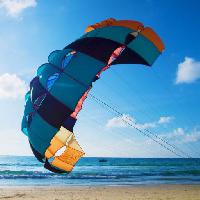 Pixwords The image with sea, beach, ocean, water, sky, clouds, parachute Basnik