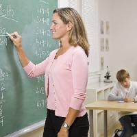 write, smile, woman, classroom, board, green Jonathan Ross - Dreamstime